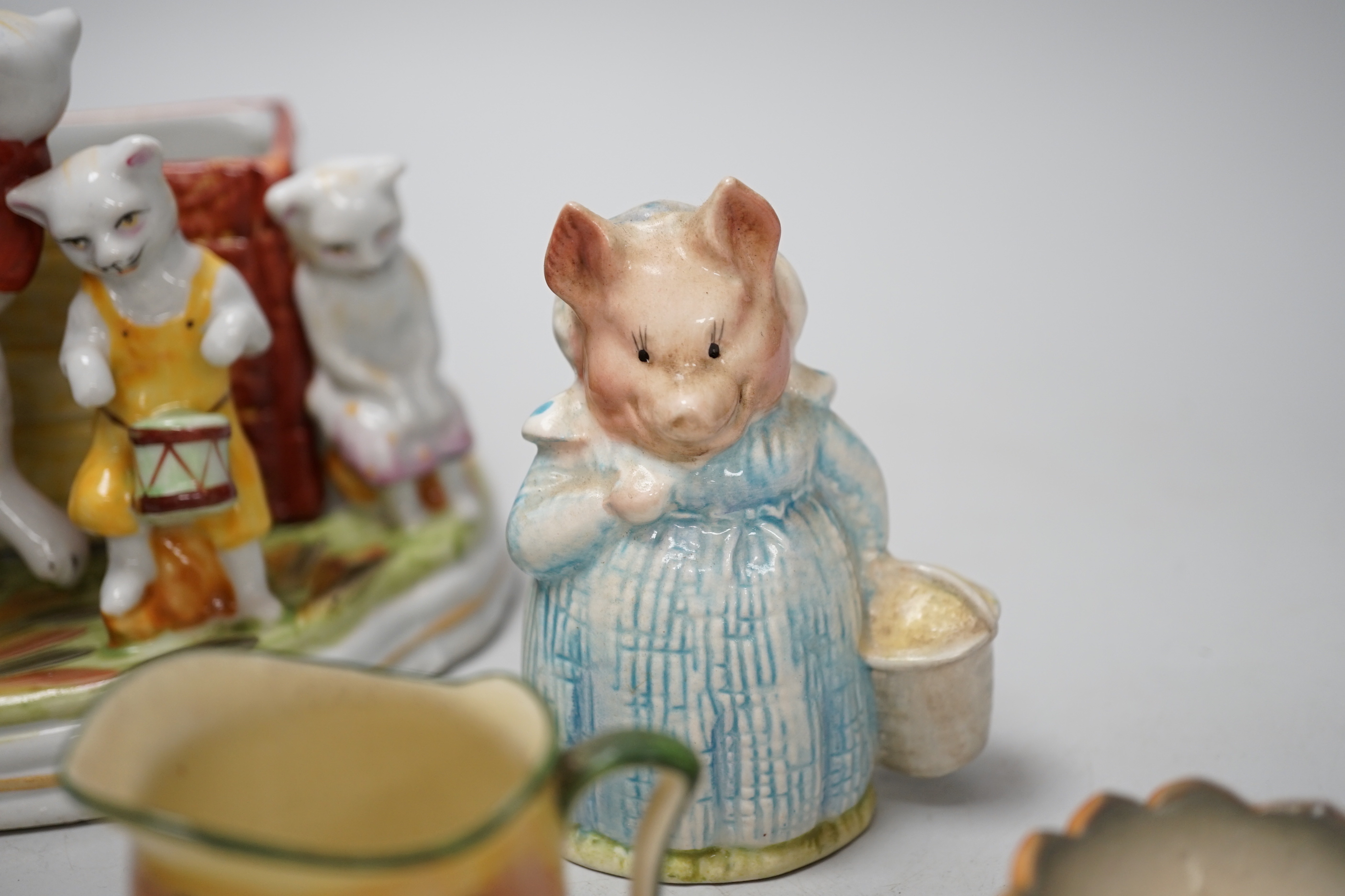A collection of Royal Doulton figures and five character mugs, tallest 16.5cm high